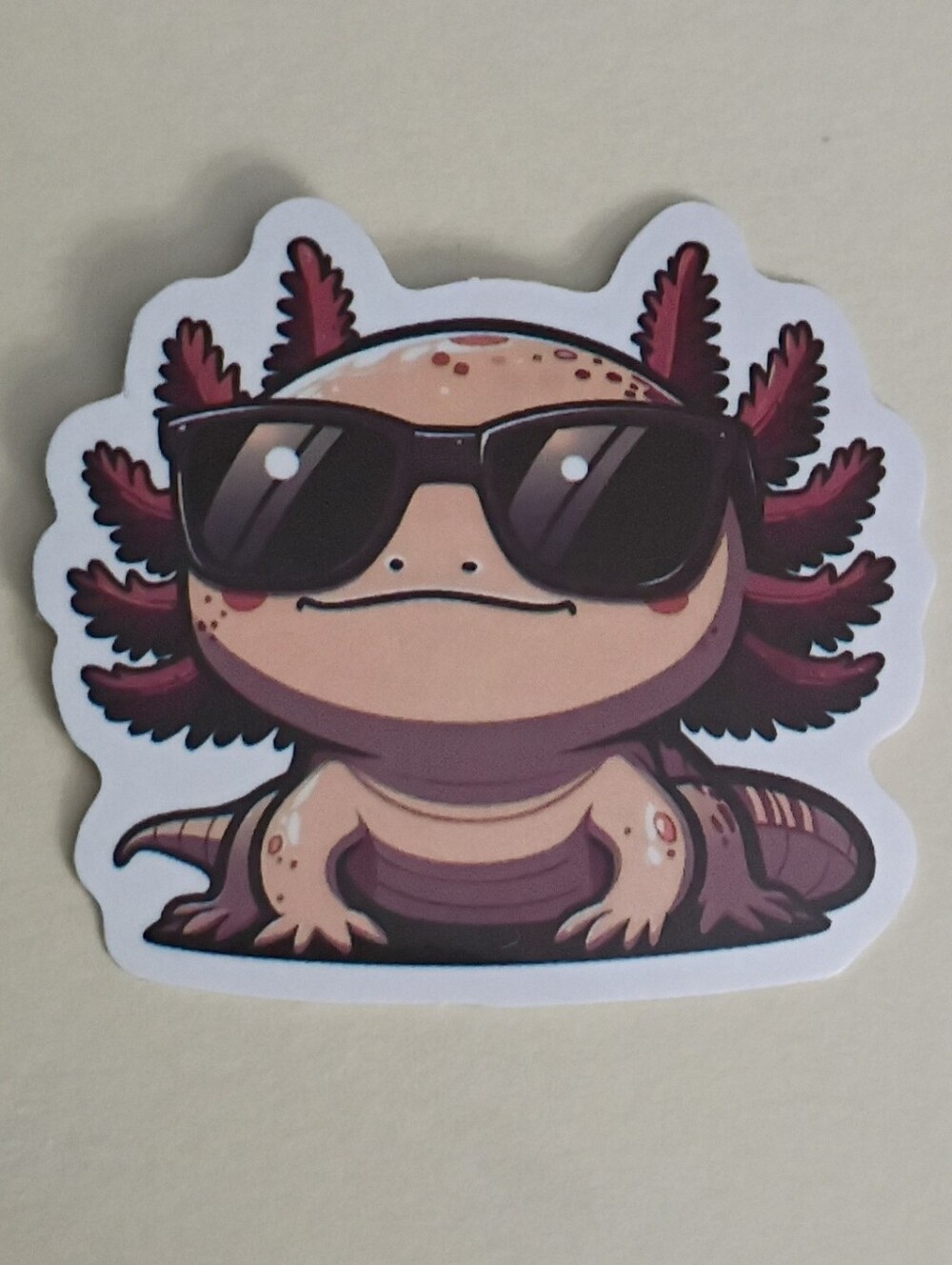 10/$10 Sticker - Pink Axolotl Cream Peachy Color Wearing Black Sunglasses